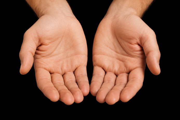 Two open hands held palms up and centered in frame, representing the shared and open nature of memorable event experiences