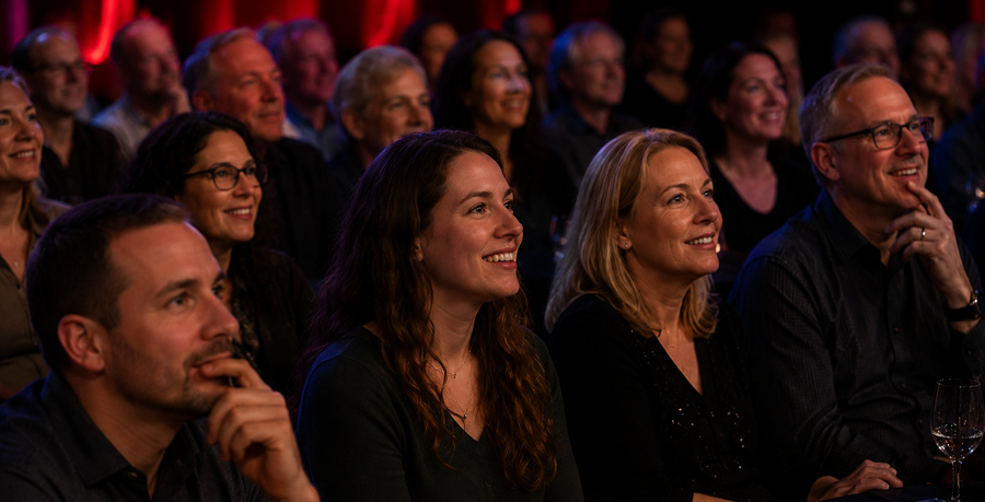 Audience members engaged during Mike Lamp's Stage Mentalist and Psychic Show presentation.